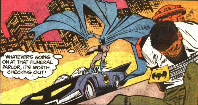 Detective Comics panel :batmobile with city backdrop