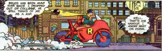 robin on his bright red toy bike