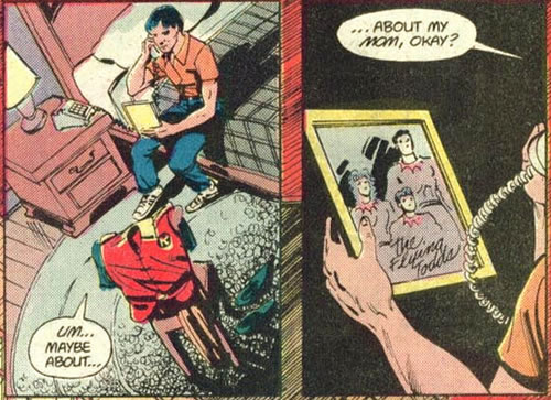 Jason Todd looks at a picture of his parents