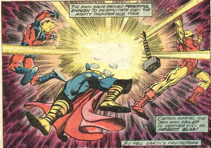 Thor takes a hit from a star ship, Iron Man and the Vision beside him