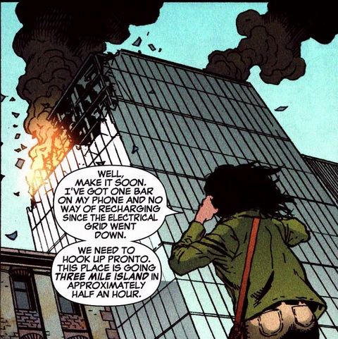 Sally Floyd talking and looking up at a burning building